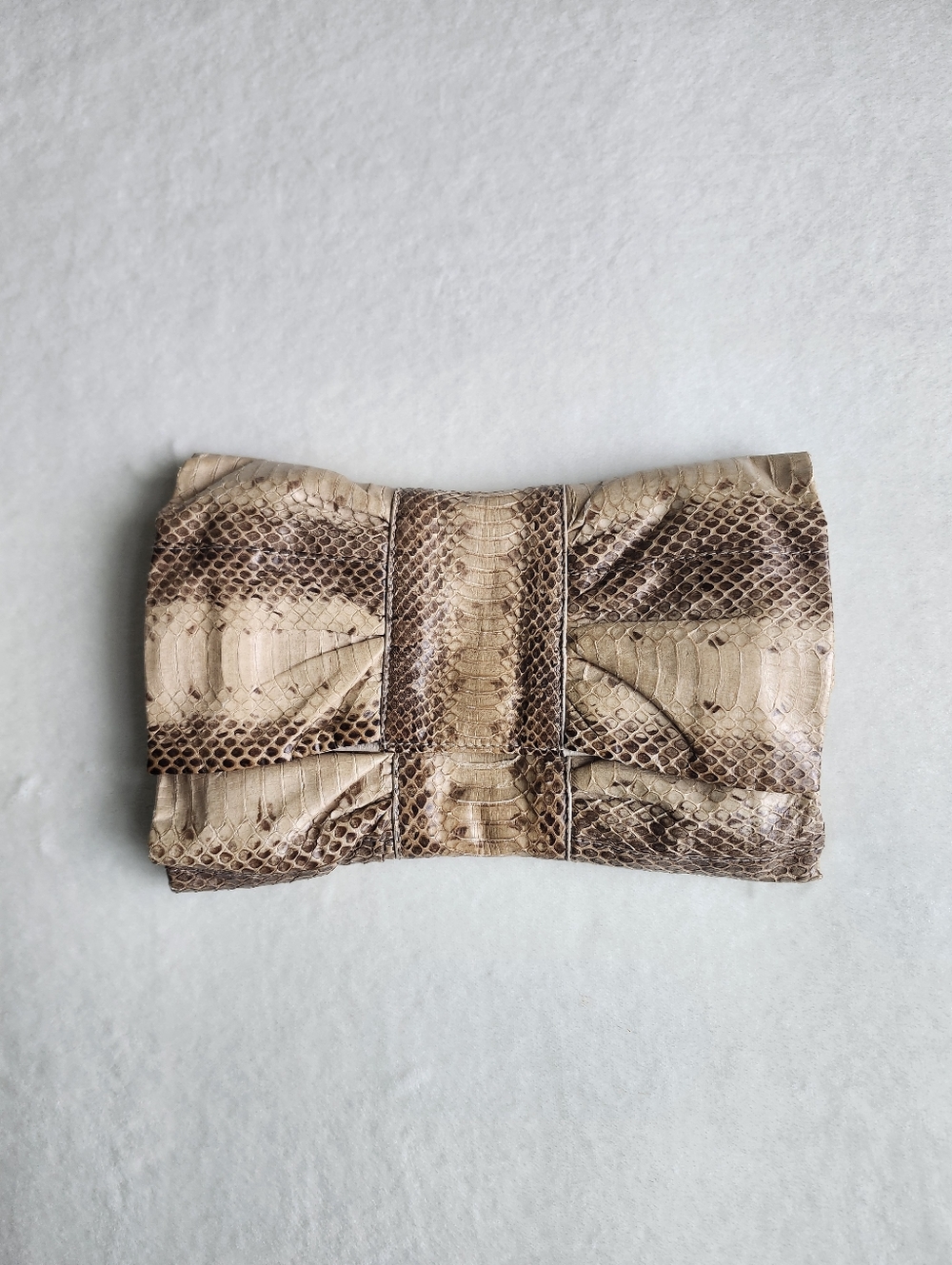 Furla Snakeskin Bow Clutch – Soft Neutral Tones
